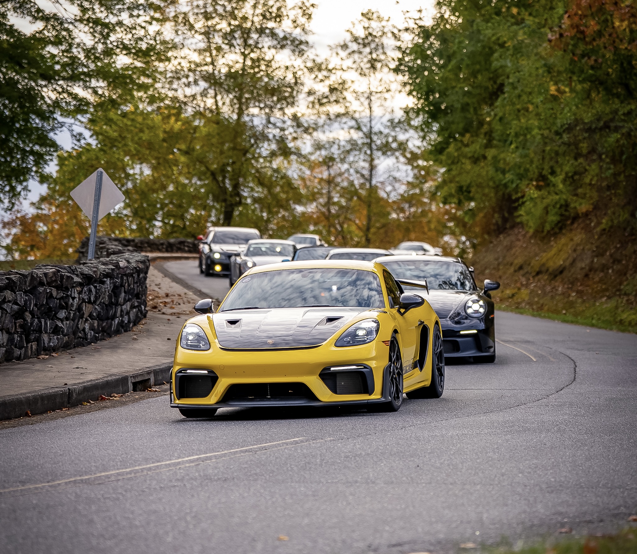 Lead Porsche GT4 RS carving through the mountains on a preview drive